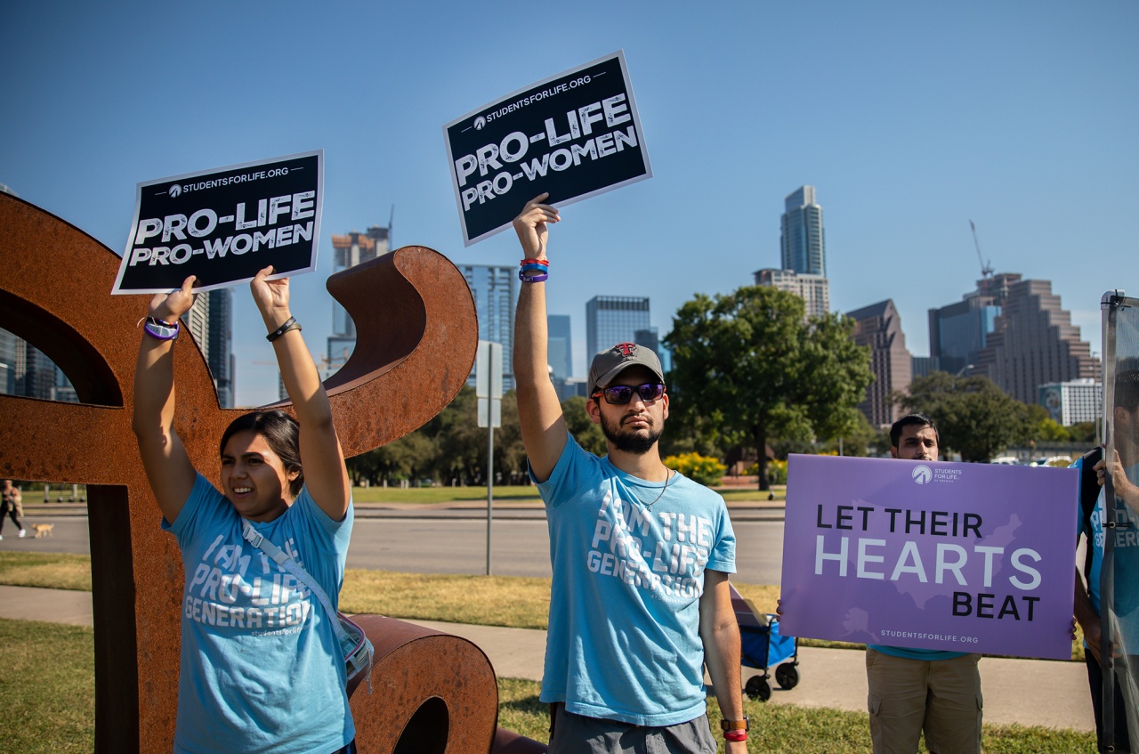 Anti-abortion rights demonstrators protest during a Women's March in Austin, Texas, on Oct. 8, 2022.