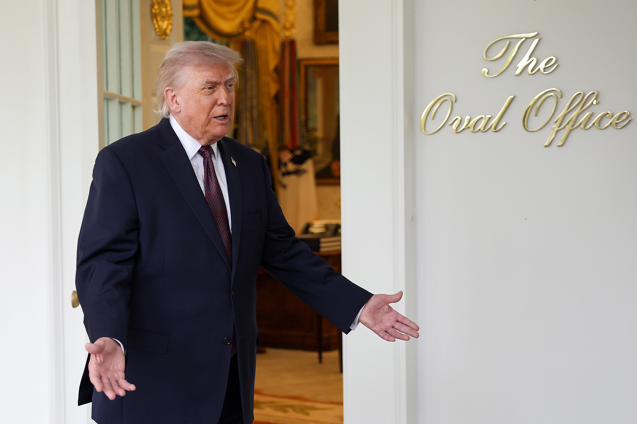 President Donald Trump speaks to members of the media during an event outside the Oval Office of the White House on April 13.