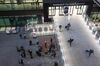 Travelers, left, stand in line for Covid-19 tests after arriving at London Heathrow Airport on Jan. 18. 