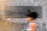 A pedestrian walks past the Credit Suisse Group AG headquarters in New York.