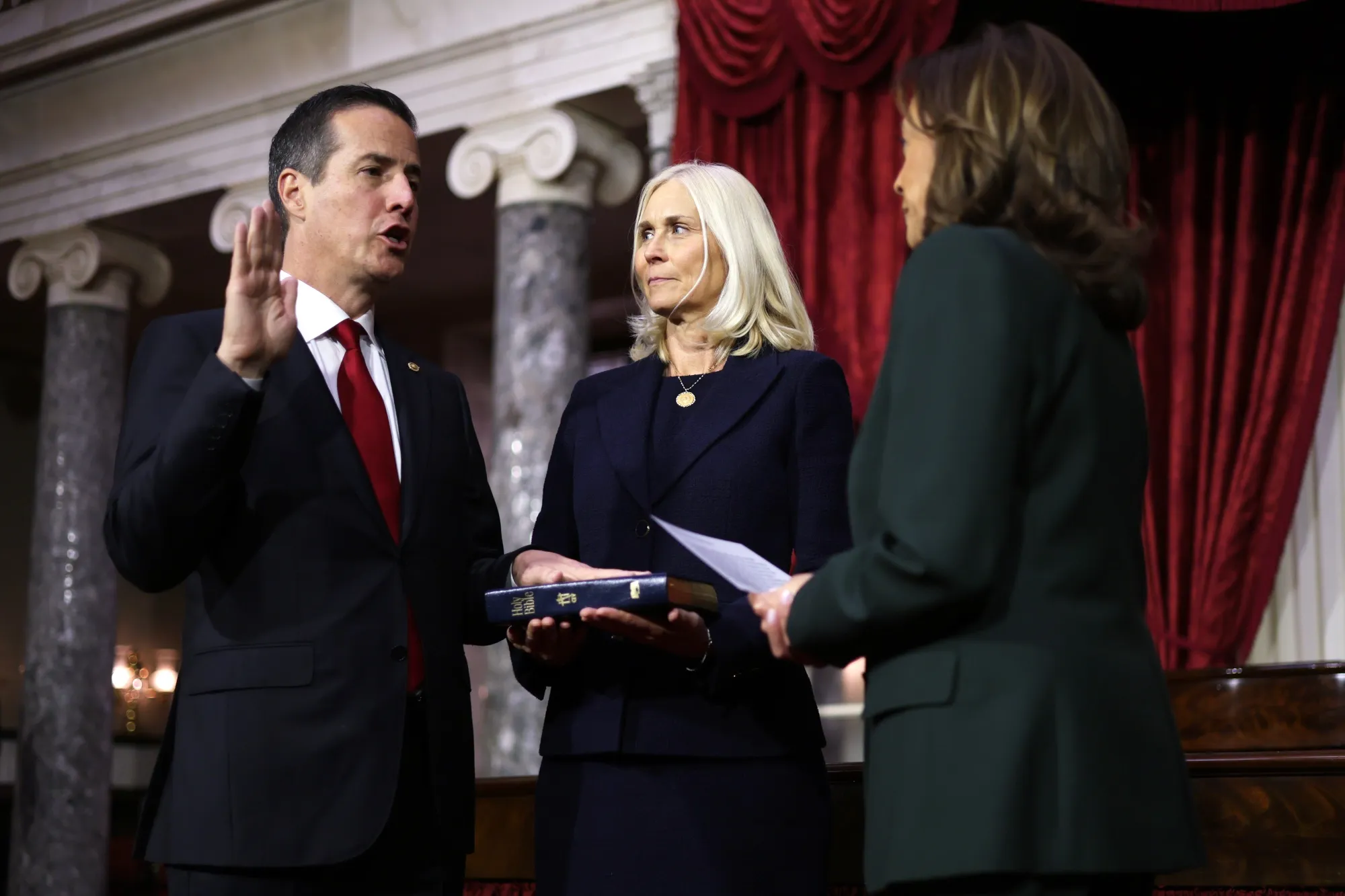 Bernie Moreno, left, during a swearing-in ceremony with his wife Bridget Moreno and Kamala Harris on Jan. 3.