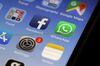 Social media apps displayed on an Apple iPhone.