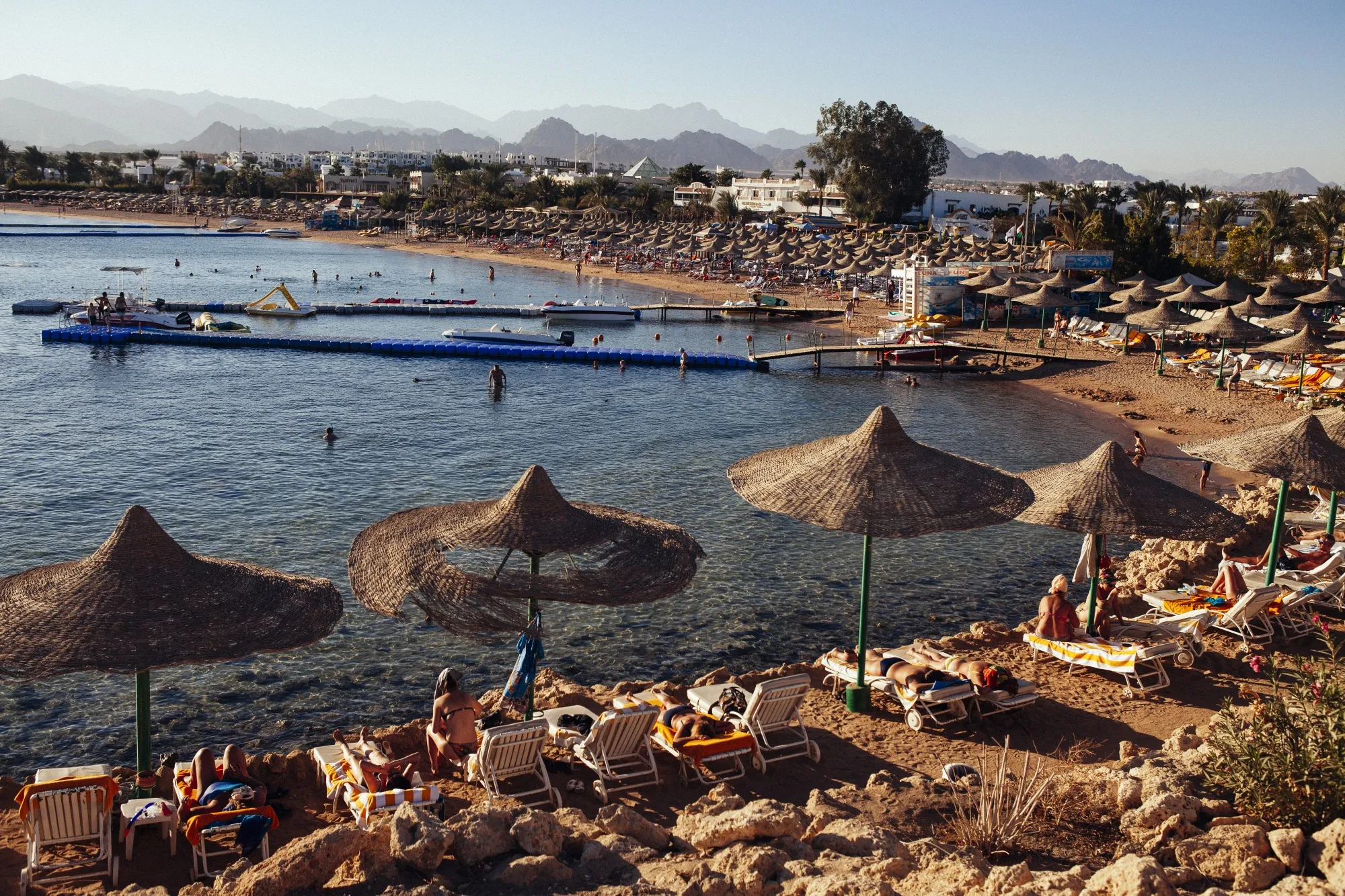 Tourists relax on beach chairs at a beach along the&nbsp;Red Sea in&nbsp;Sharm El Sheikh, Egypt.