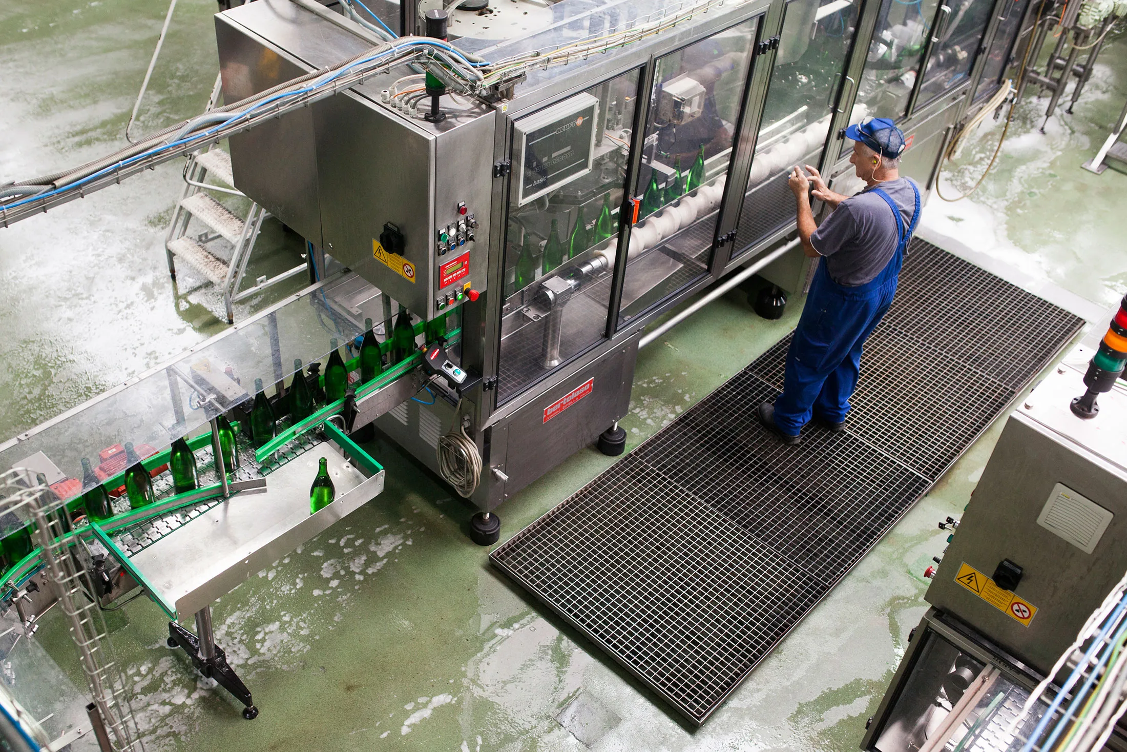 A man works on the production line at a cider plant in Bilgoraj, Poland, on Aug. 27, 2014.
