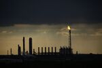 A gas flare at a Chevron Phillips Chemical Co. plant ahead of Hurricane Laura in Port Arthur, Texas, U.S., on Tuesday, Aug. 25, 2020. Hurricane Laura is poised to become a roof-ripping Category 3 storm when it comes ashore along the Texas-Louisiana coast, threatening to inflict as much as $12 billion of damage on the region and potentially shutting 12% of U.S. refining capacity for months.