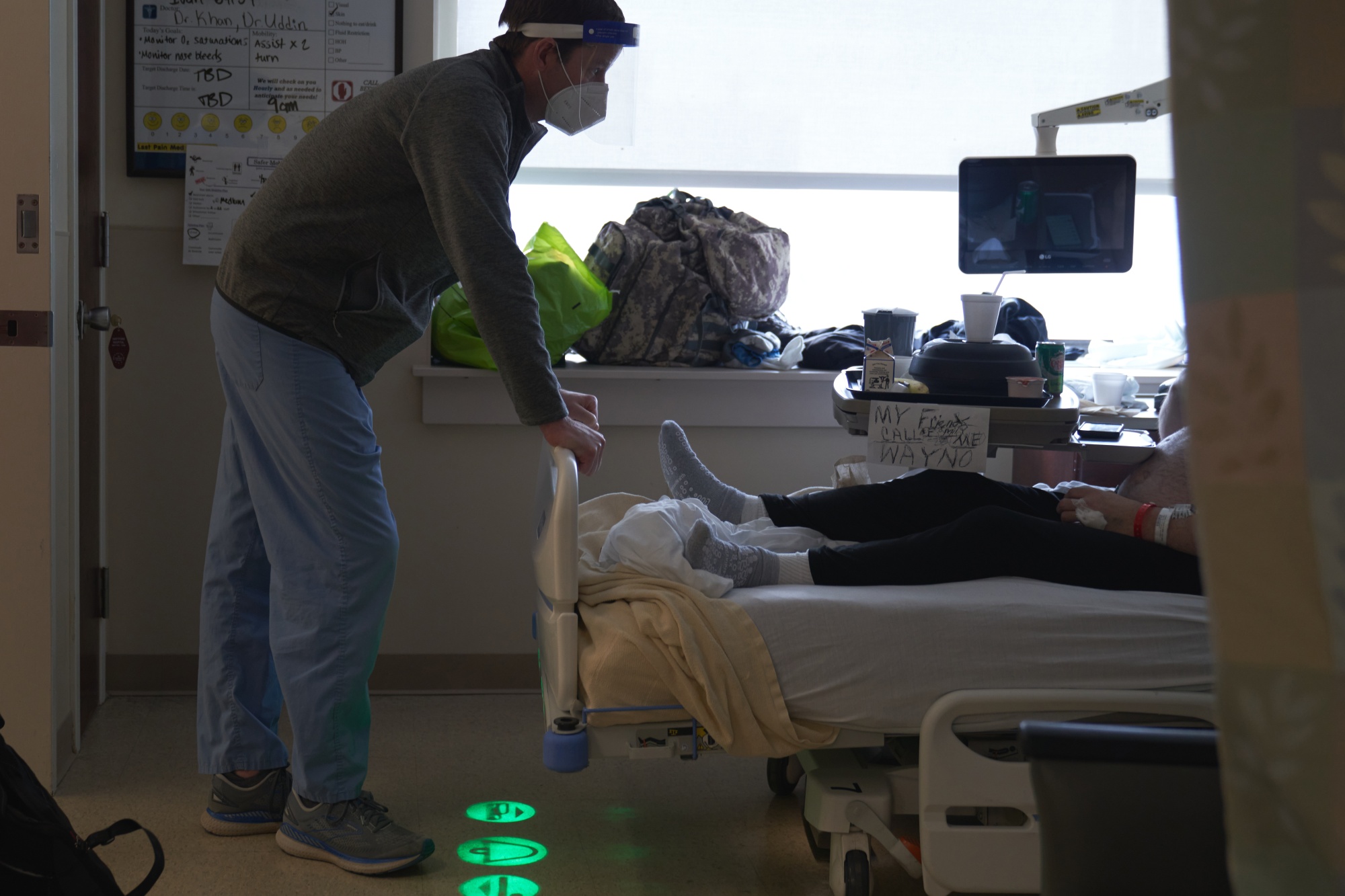 A doctor speaks with a&nbsp;Covid-19 patient on the ICU&nbsp;floor at Hartford Hospital in Hartford, Connecticut.