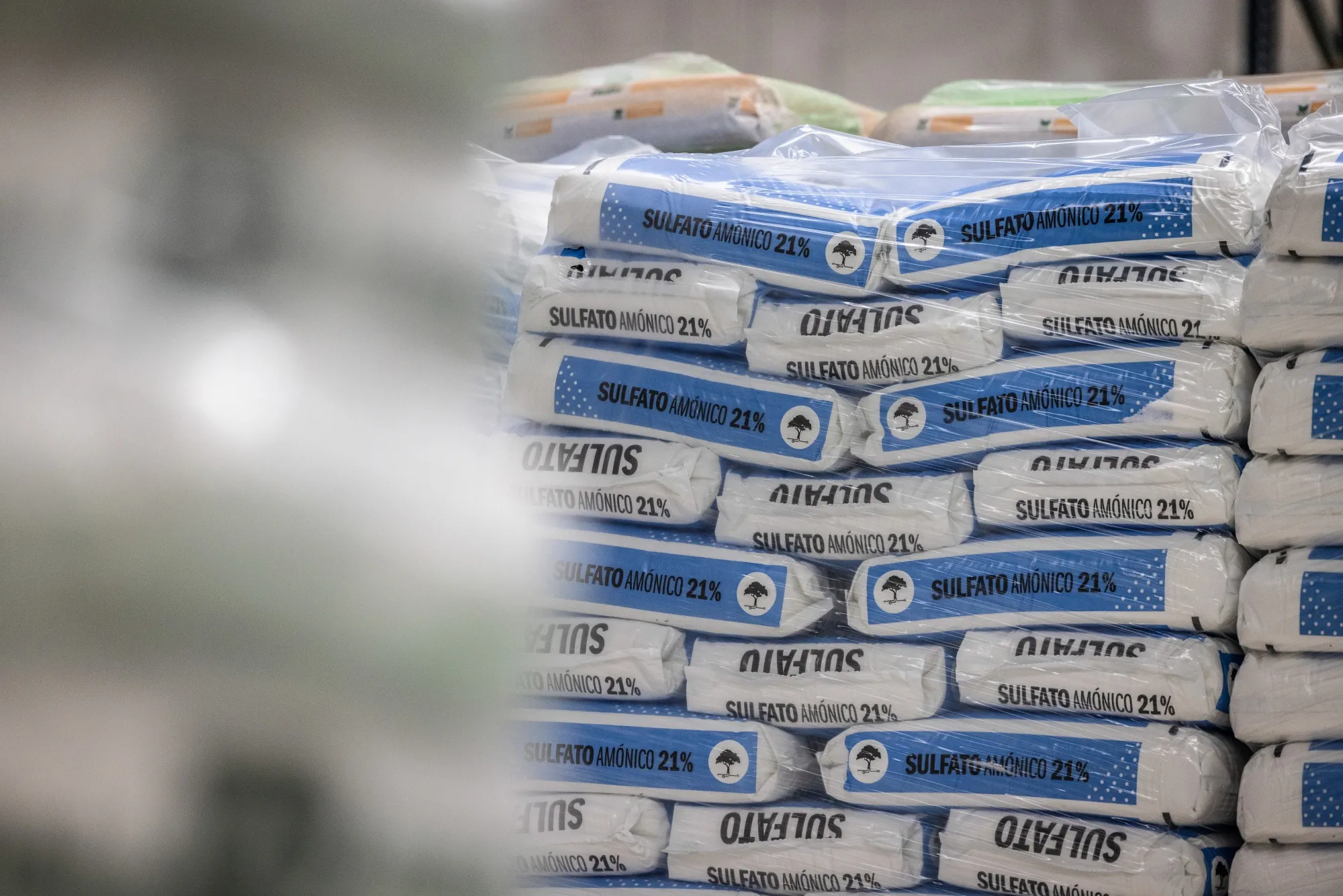 Bags of ammonium sulphate fertilizer at wholesale fertilizer distributor Agroborges’ warehouse near Lleida, Spain.