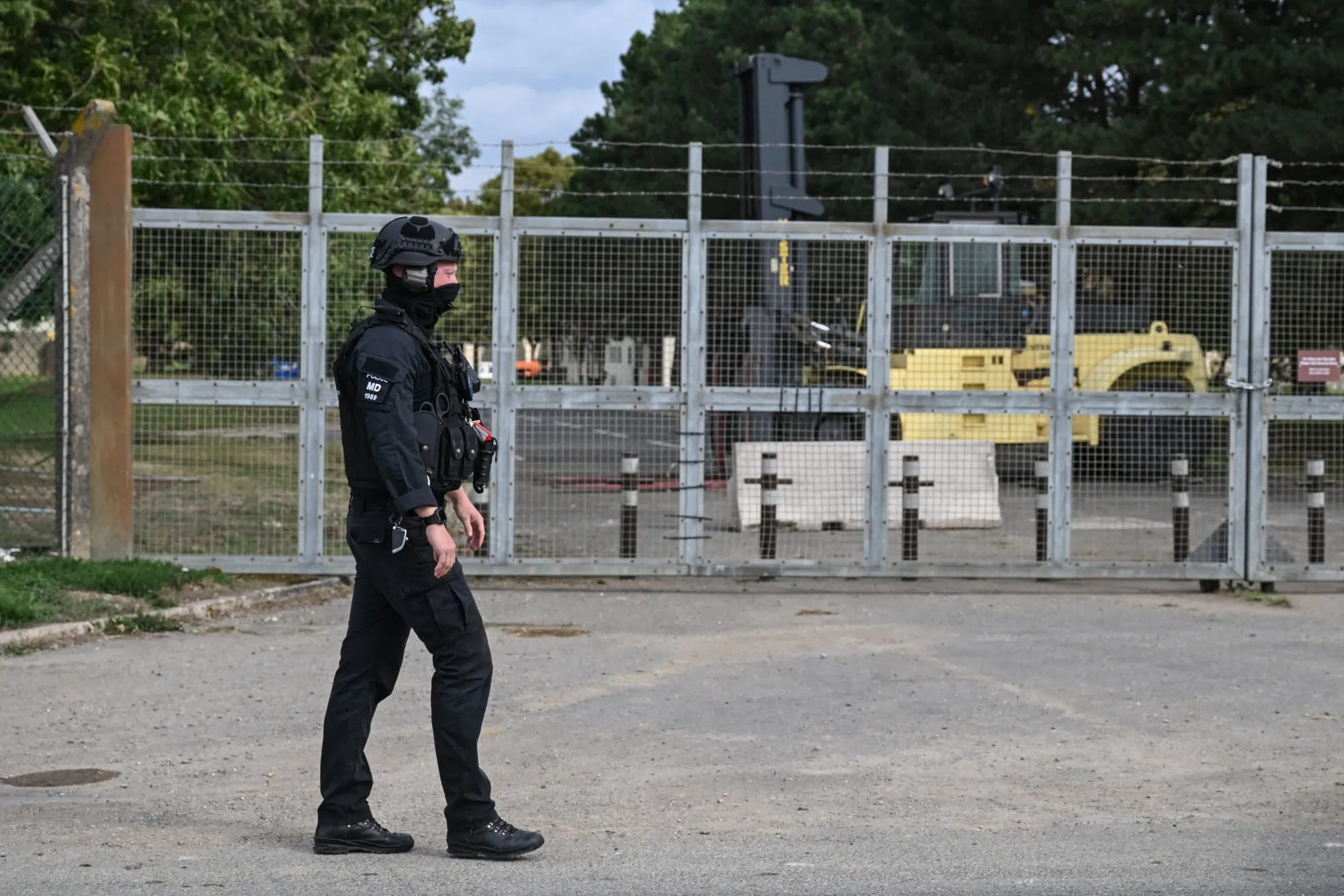 A policeman guards an entrance to RAF Fairford base in Fairford, England on Sept. 27.