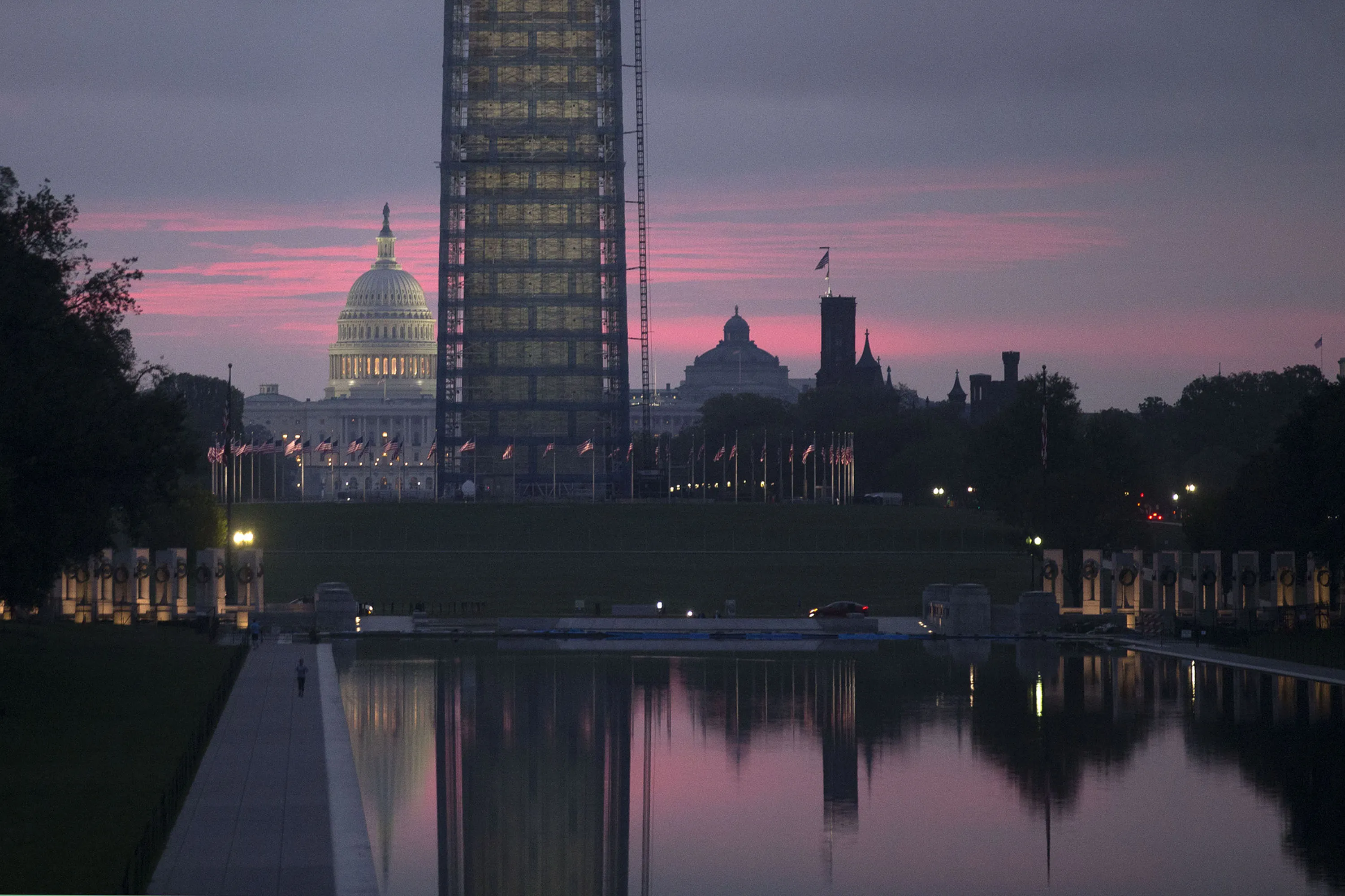 The U.S. Capitol stands past the Washington Monument Memorial in Washington.