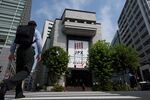 Pedestrians walk past the Tokyo Stock Exchange (TSE), operated by Japan Exchange Group Inc. (JPX), in Tokyo, Japan, on Tuesday, July 24, 2018.
