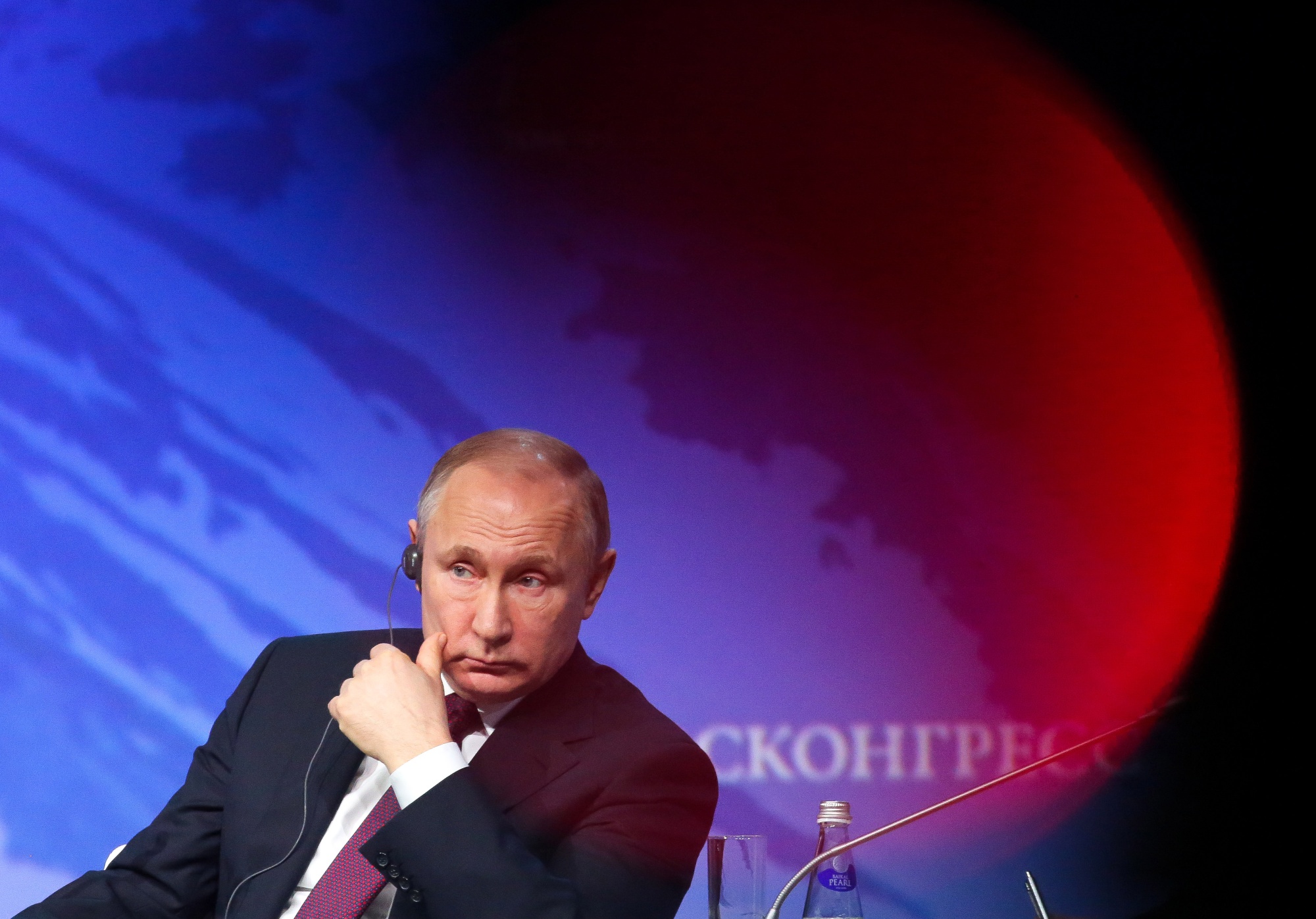 Vladimir Putin, Russia's president, listens during the International Arctic Forum in St. Petersburg, Russia.