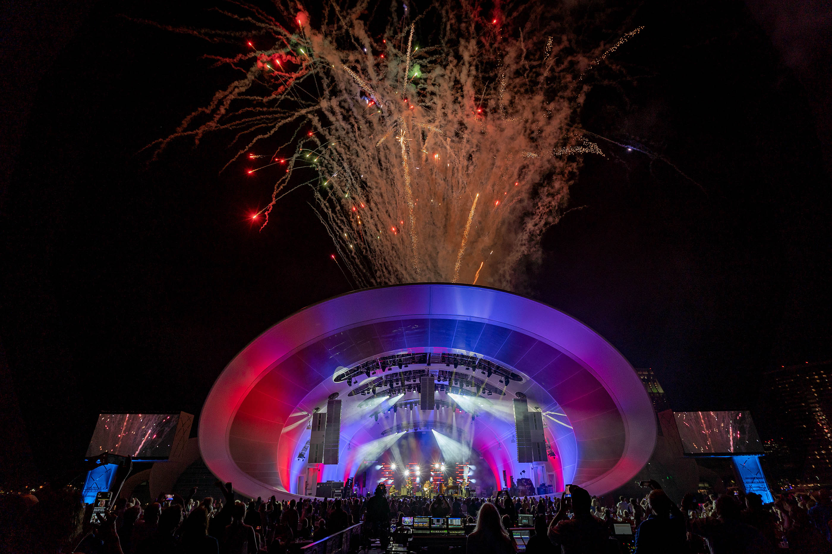 Fireworks explode in the sky above the Rady Shell, an outdoor concert venue in San Diego.