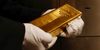 An employee holds a gold bar weighing 12.5 kilograms in the precious metals vault at Pro Aurum KG in Munich, Germany, on Wednesday, July 10, 2019. Gold rose for a third day after the Federal Reserve indicated that it’s preparing to cut interest rates for the first time in a decade as the global economy slows.