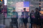 Monitors display stock market information at the Nasdaq MarketSite in New York, on Jan. 21. 