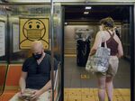 A sign notifies commuters to wear a mask inside a subway in New York, on&nbsp;May 22.