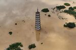 The Wenfeng Tower in Guangdong Province is submerged in flood water after torrential rains on June 22.