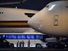 A bus with passengers believed to be U.S. citizens sits near planes at Haneda Airport in Tokyo on Feb. 17.
