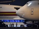 A bus with passengers believed to be U.S. citizens sits near planes at Haneda Airport in Tokyo on Feb. 17.