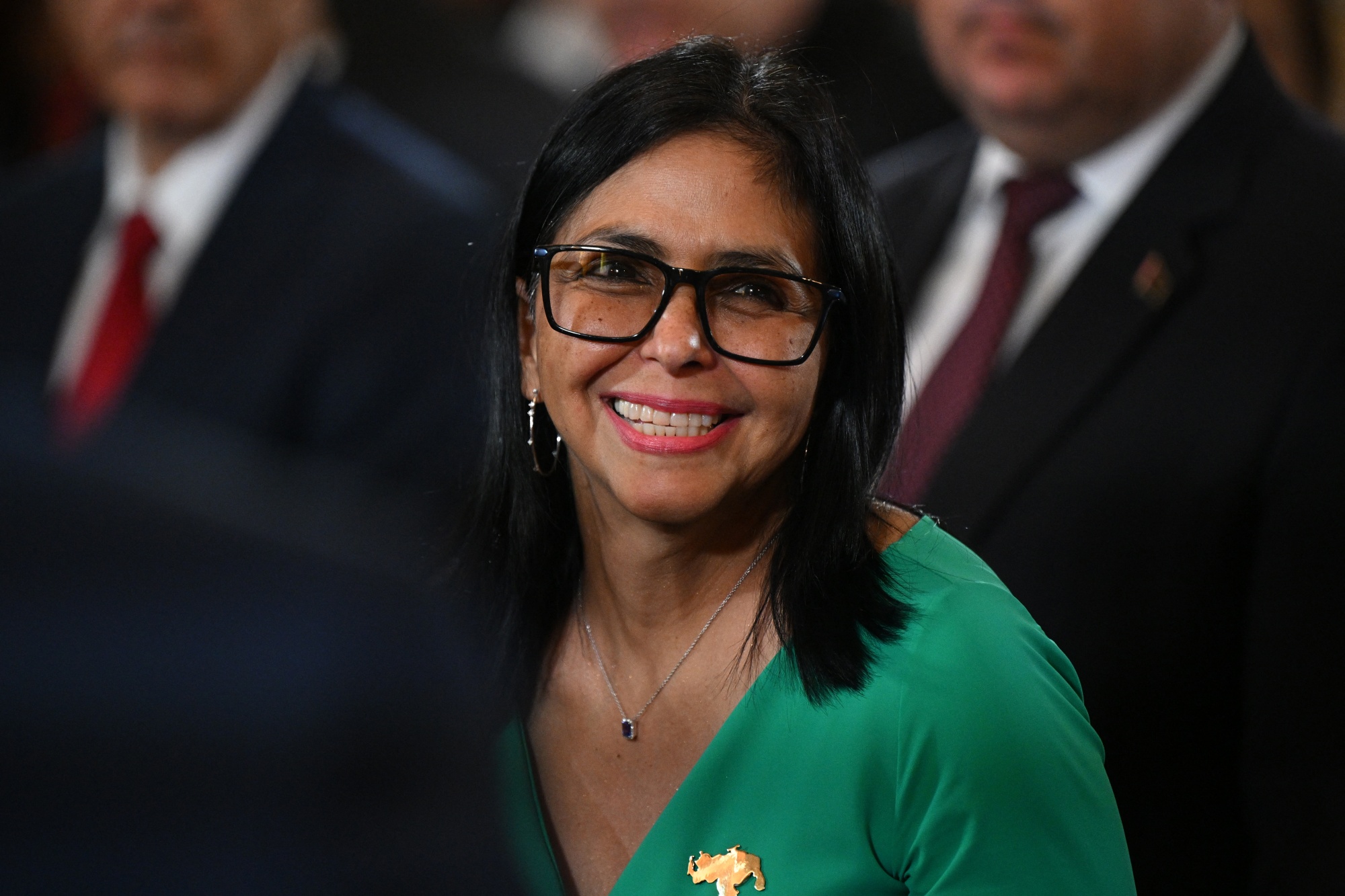 TOPSHOT - Venezuela's interim President Delcy Rodriguez smiles after a session of the National Assembly in Caracas on January 5, 2026. Venezuela's new parliament opened on January 5 with lawmakers chanting "Let's go Nico!" as they forcibly denounced the recent capture of leftist leader Nicolas Maduro in a US military operation on January 3. (Photo by Federico PARRA / AFP via Getty Images)