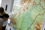 A young refugee from Kosovo stands in front of a map of Hungary with her teacher during a geography class in Bekescsaba, Hungary, in 2007.