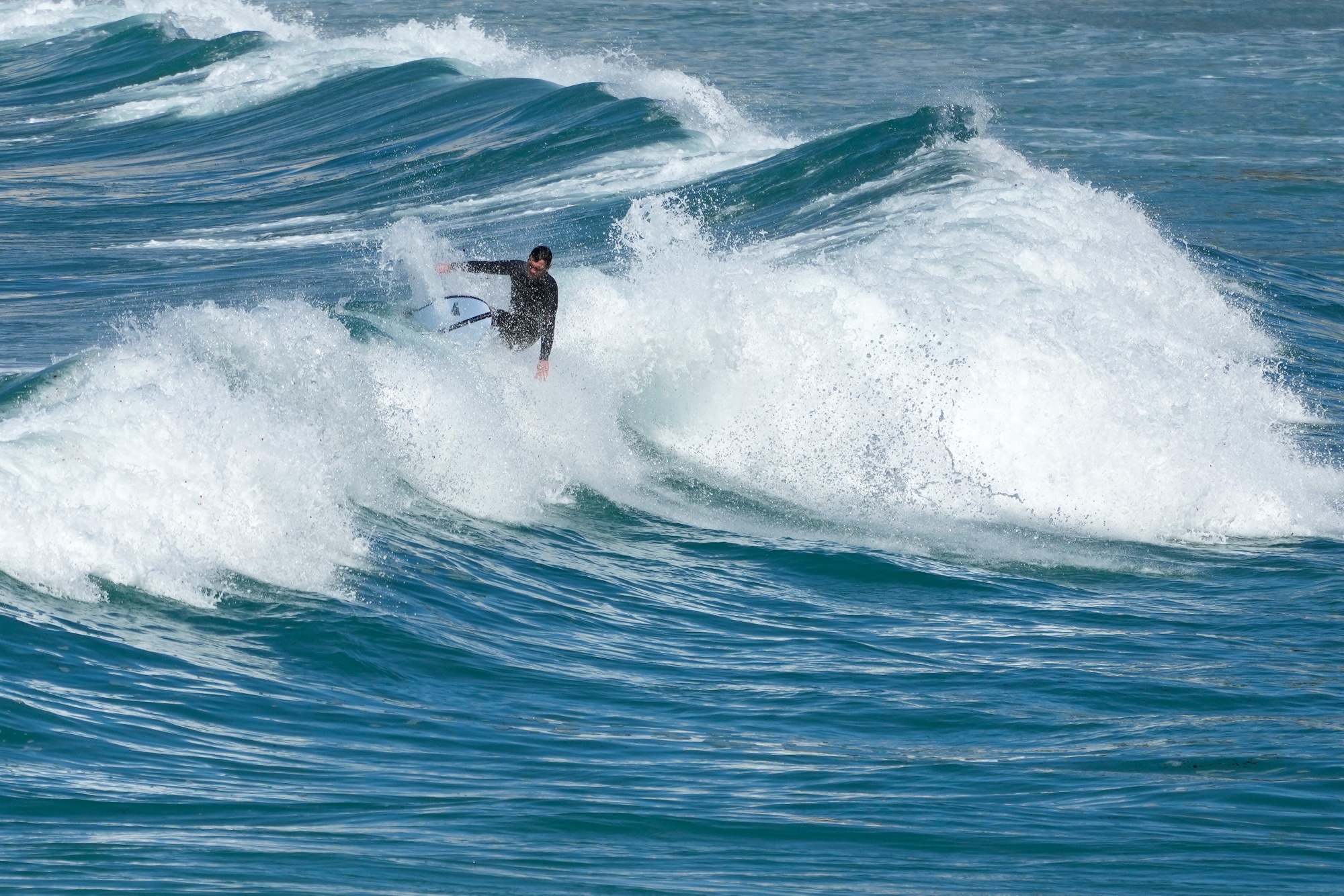  A surfer in the waters off Arteixo, Spain