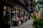 Customers dine outside at Copinette restaurant in New York.