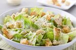 caesar salad, with romaine lettuce hearts, croutons, parmesan cheese and dressing.