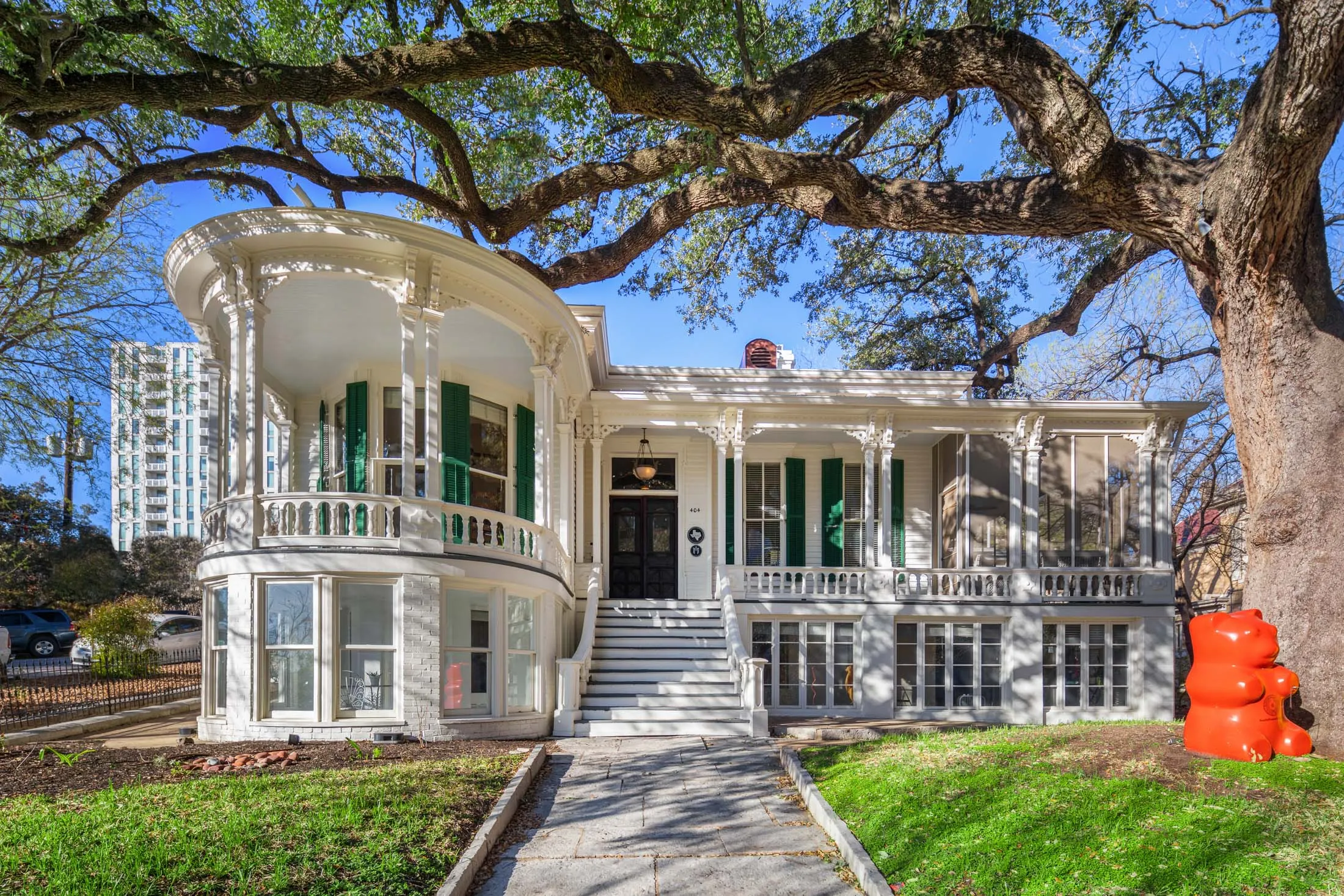 The first historic house that Mueller bought, which comes with a large oak tree.