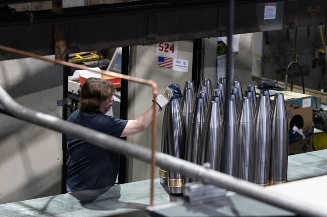 An employee readies projectiles for the finish turn at the Scranton Army Ammunition Plant.