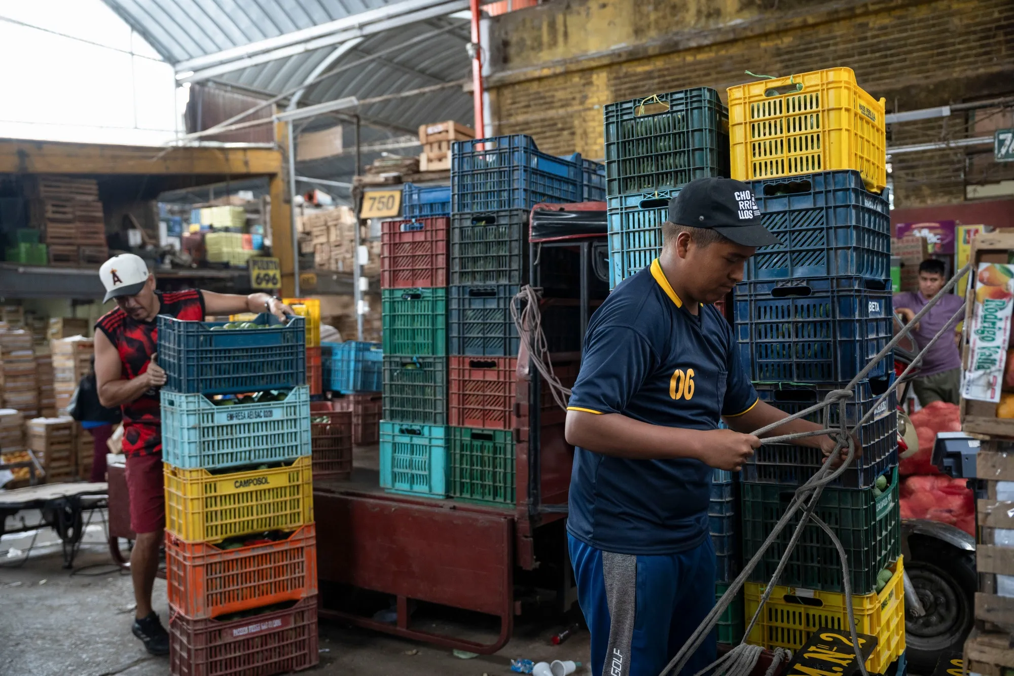 Vendors at a fruit market in Lima, Peru.
