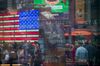 Monitors display stock market information as pedestrians are reflected in a window at the Nasdaq MarketSite in the Times Square area of New York, U.S., on Friday, Sept. 6, 2019. U.S. stocks advanced and Treasuries were mixed as Federal Reserve Chairman Jerome Powell’s latest comments did little to alter views on Federal Reserve policy.