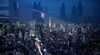 The Tokyo Tower (C) is illuminated amongst the city skyline as visitors are reflected in glass while visiting the Shibuya Sky observation deck in Tokyo on September 8, 2020. (Photo by Philip FONG / AFP) (Photo by PHILIP FONG/AFP via Getty Images)