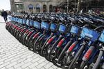 Rows of Citi Bikes are lined up in New York City. The city's bikeshare system is now owned and operated by Lyft, and the company's efforts to restrict access to the bikes have come under fire.