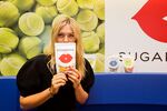 Sharapova poses with a Sugarpova candy packet during the French launch of her candy collection on May 22 in Paris