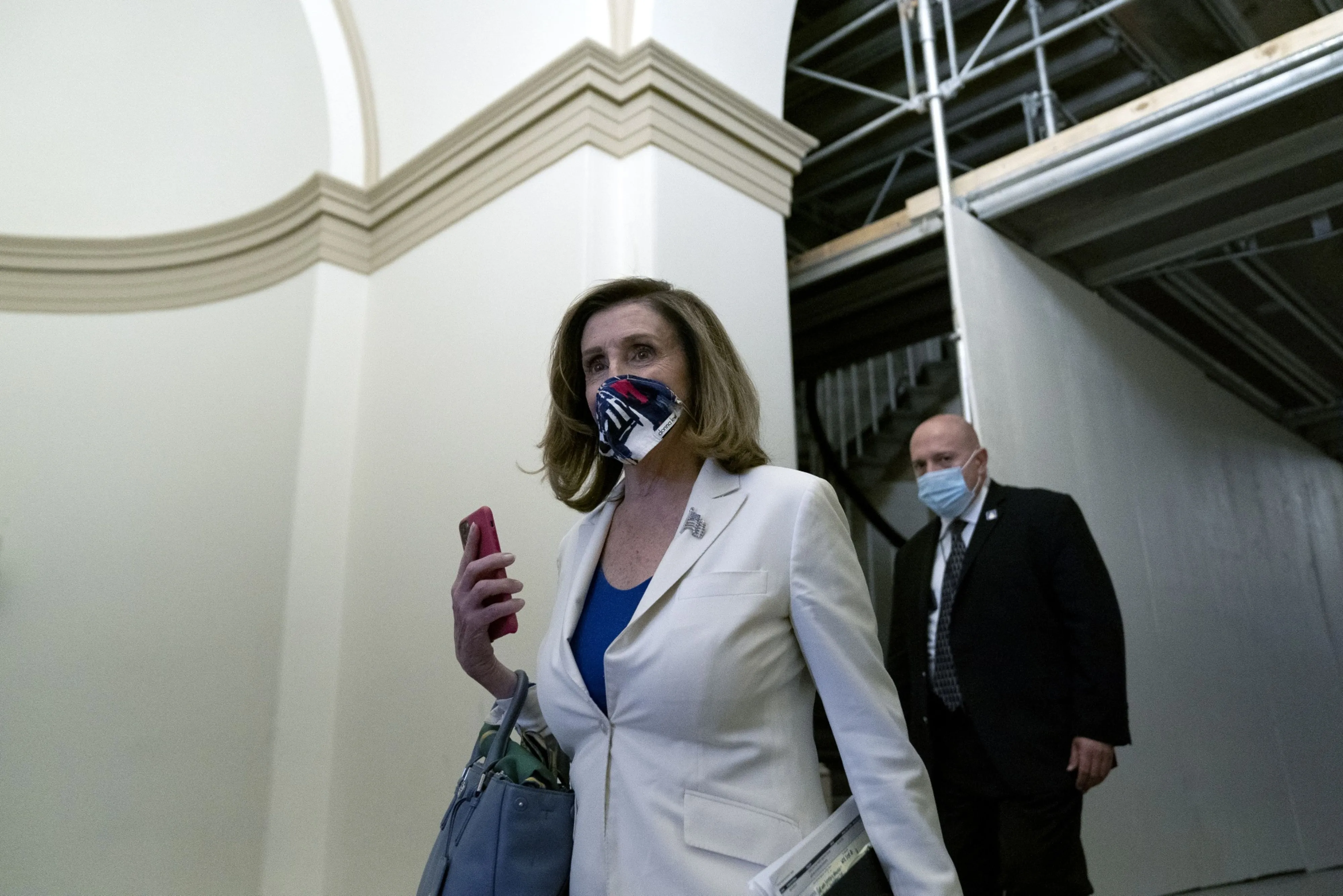 U.S. House Speaker Nancy Pelosi wears a protective mask as she departs the U.S. Capitol on Thursday, Oct. 1. &nbsp;