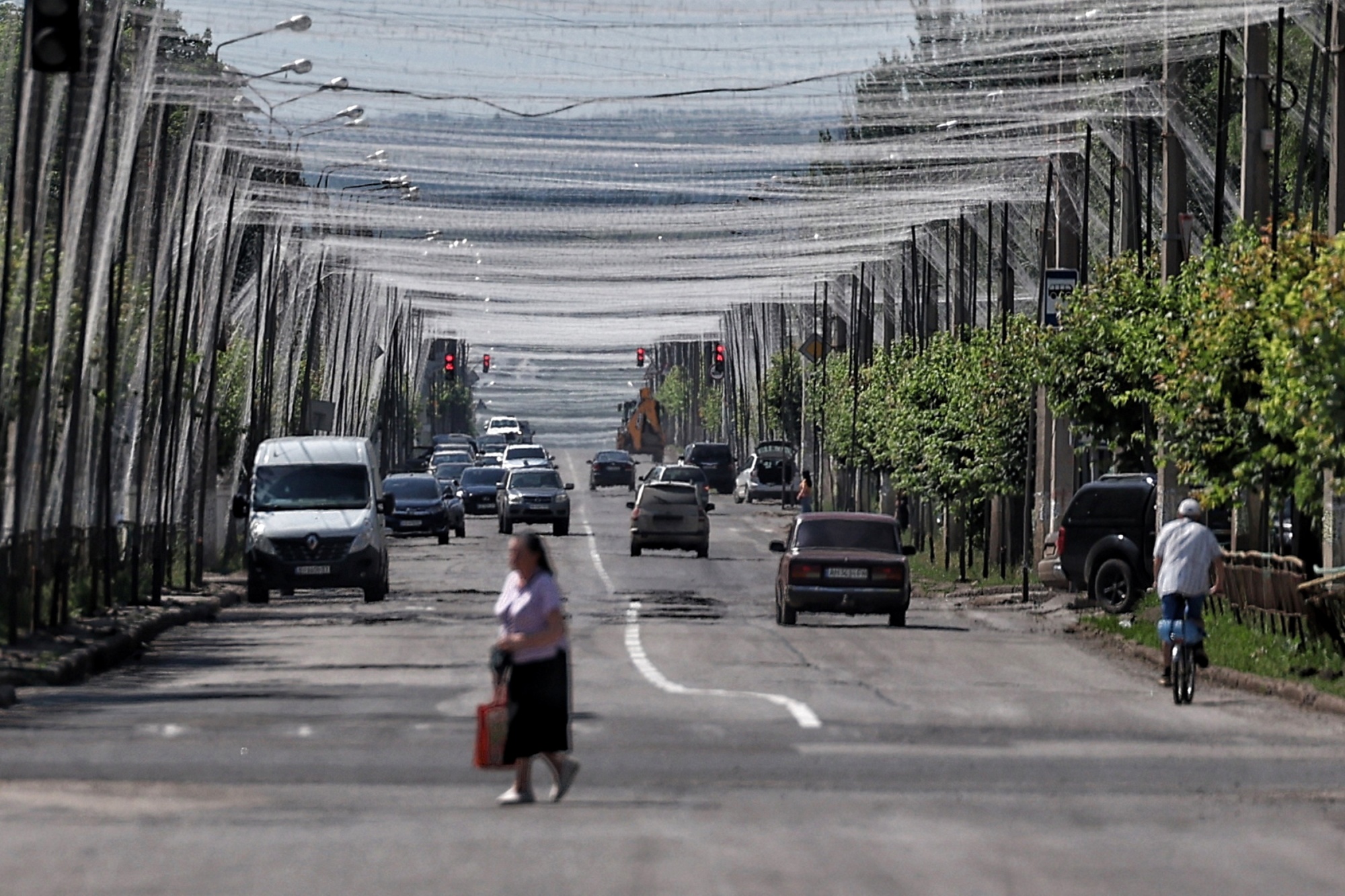 A road covered with anti-drone netting in Kramatorsk, on June 7. Photographer: Yan Dobronosov/Global Images Ukraine/Getty Images