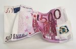 Crumpled 500 euro banknote.