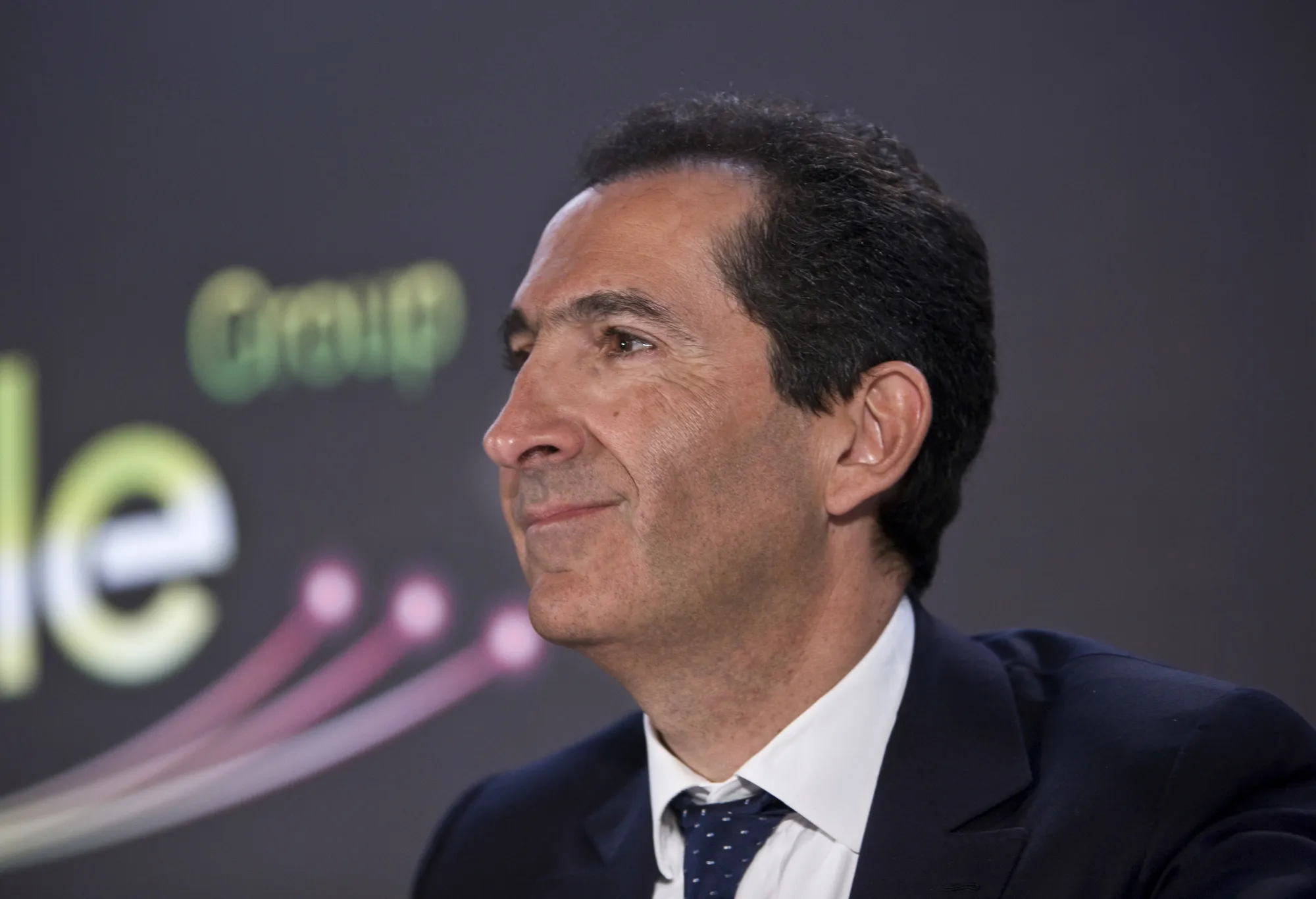 Patrick Drahi, billionaire and chairman of Altice SA, reacts during a news conference in Paris, France, on Monday, March 17, 2014. Drahi is on his way to buying SFR and merging it with Numericable SA, the cable provider he controls, if talks with SFR owner Vivendi SA result in a deal in the coming weeks.