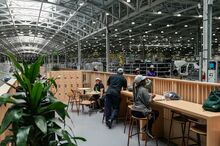 Employees take a break in a sitting area at the Hyundai Metaplant.