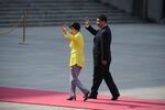 South Korean President Park Geun-Hye and Chinese President Xi Jinping wave during a visit welcoming ceremony outside the Great Hall of the People in Beijing, China.
