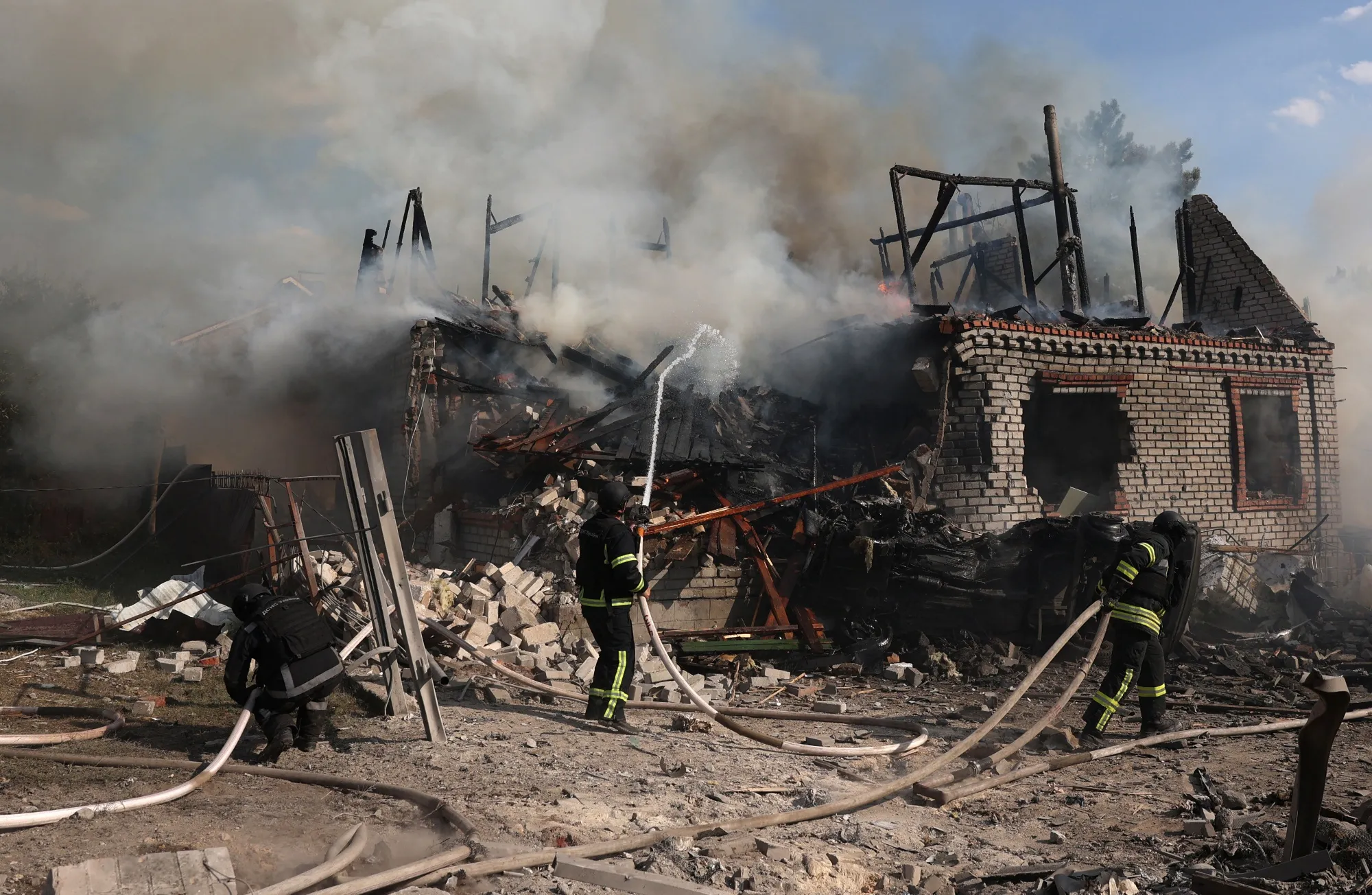 Rescuers put out a fire in a private house destroyed during a missile attack in Kostyatynivka town, Donetsk region.