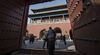 Visitors walk through a gate inside the Palace Museum at the Forbidden City in Beijing,