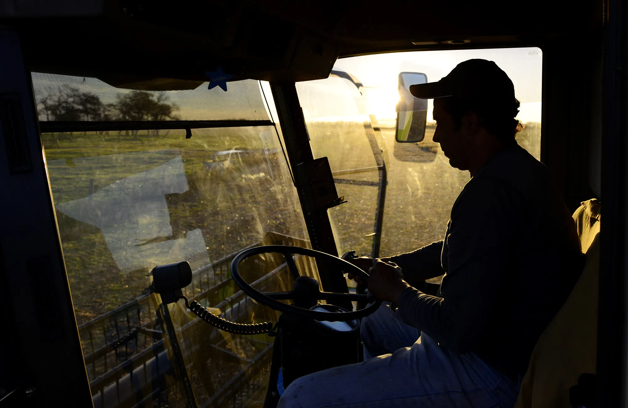 A farmer drives his tractor during harvest near Salto, in the north of Buenos Aires province, Argentina.