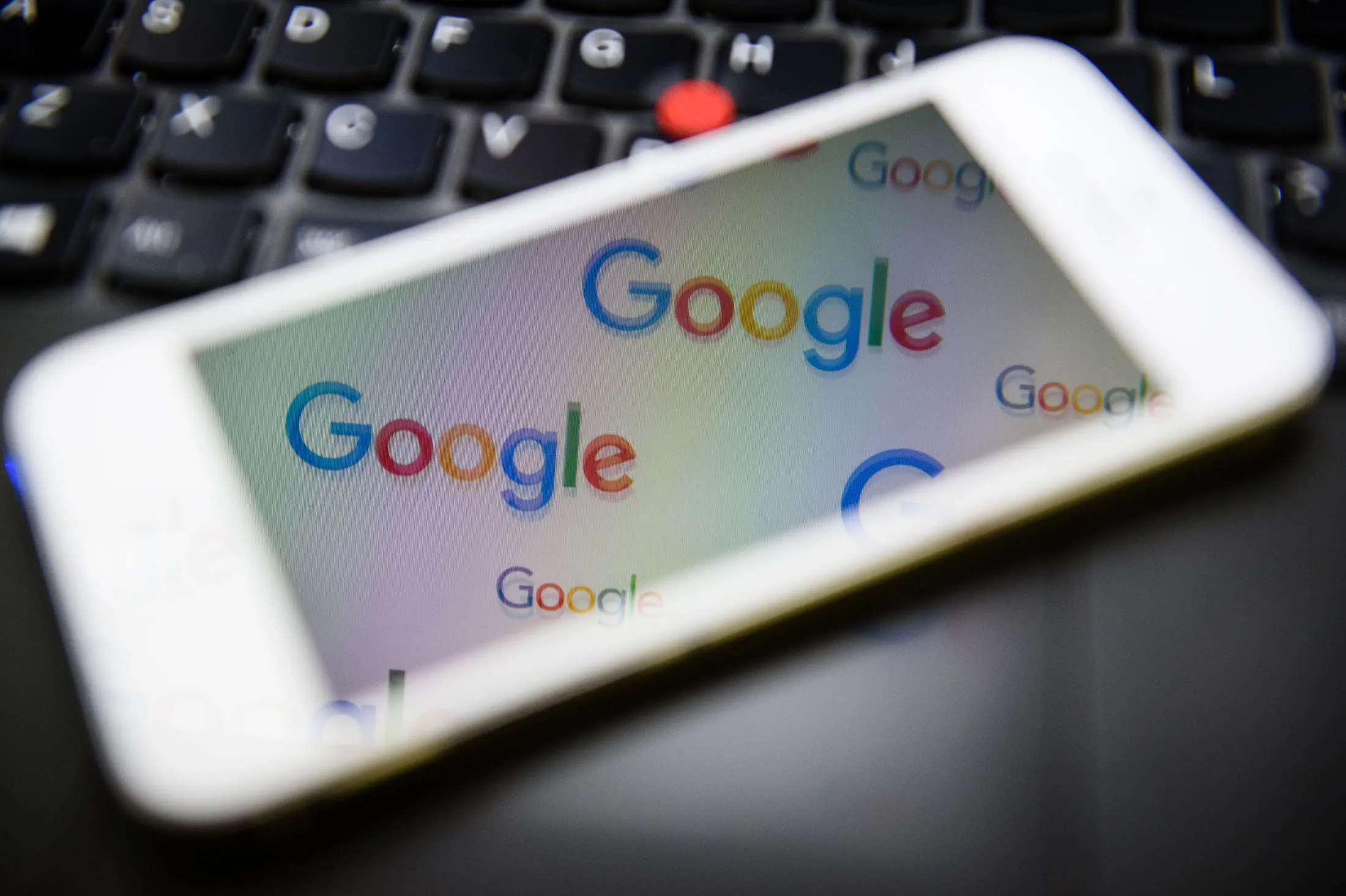 The logo for US technology company and search engine Google is displayed on screens in London on February 11, 2016. Britain's tax agency announced last month that Google would pay a £130 million (166 million euro, $187 million) tax settlement for 10 years' operations in Britain where it makes 11 percent of its global sales. Finance minister George Osborne hailed the agreement as a victory. But there was a barrage of criticism, including from within Prime Minister David Cameron's own Conservative Party as the announcement coincided with a key tax filing deadline for many Britons. / AFP / LEON NEAL (Photo credit should read LEON NEAL/AFP/Getty Images)
