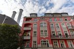 Chimney stacks at the Mitte Combined Heat and Power&nbsp;natural gas power plant behind apartment buildings in&nbsp;Berlin, Germany, on Aug. 9. 2022.&nbsp;