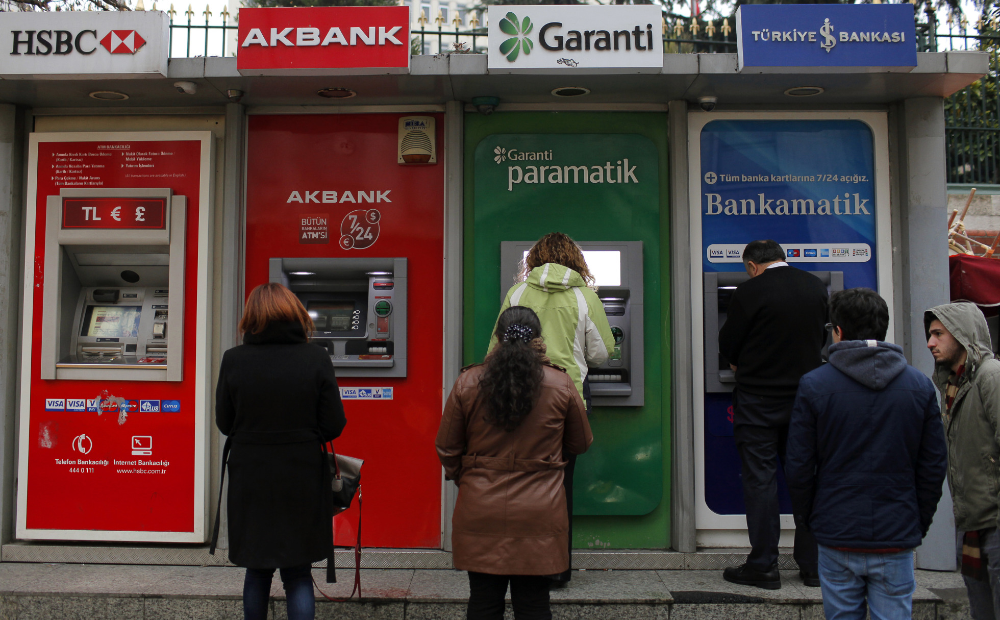 Customers queue outside automated teller machines&nbsp;in Istanbul.