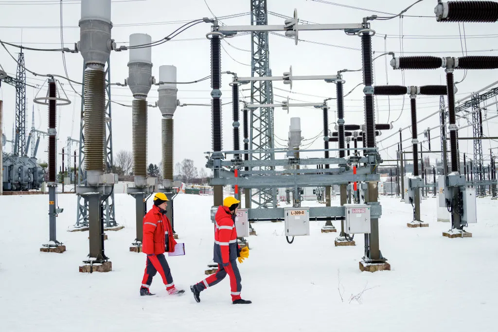 Technicians arrive at the power substation in Rezekne, Latvia to disconnect the major power line between Latvia and Russia.