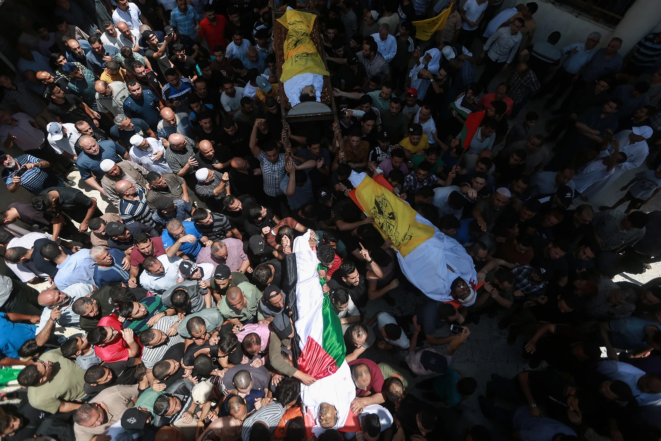 Mourners attend the funerals of Palestinians killed in recent Israeli air strikes in Gaza, on Aug.&nbsp;7.
