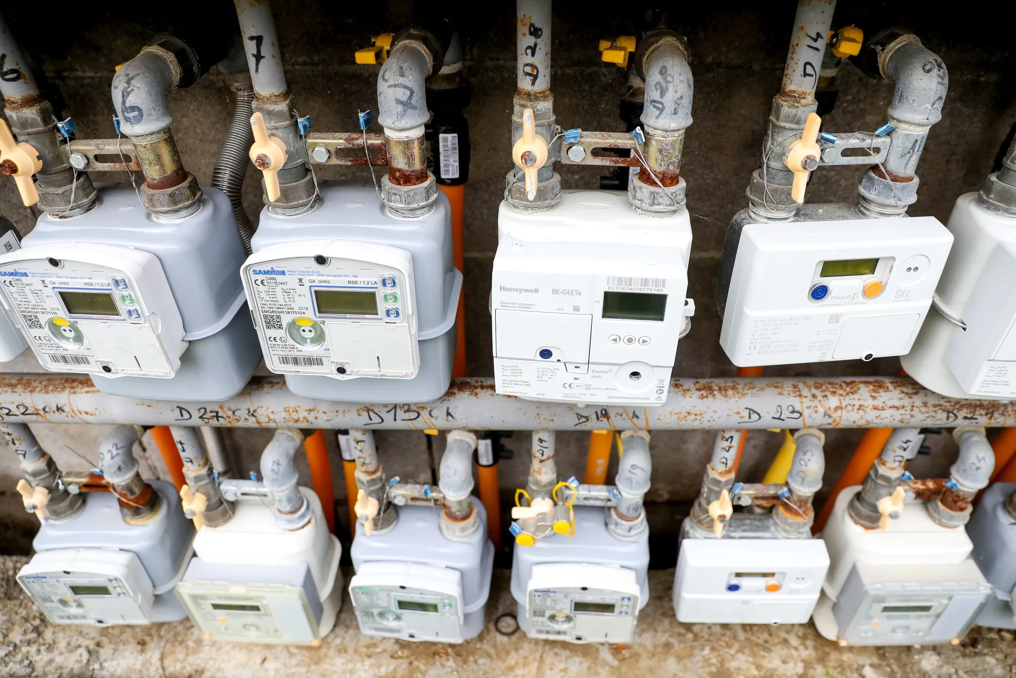 Gas meters outside residential buildings in Rome.