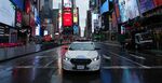 A New York Police Department car drives through an empty Times Square in New York on March 28.